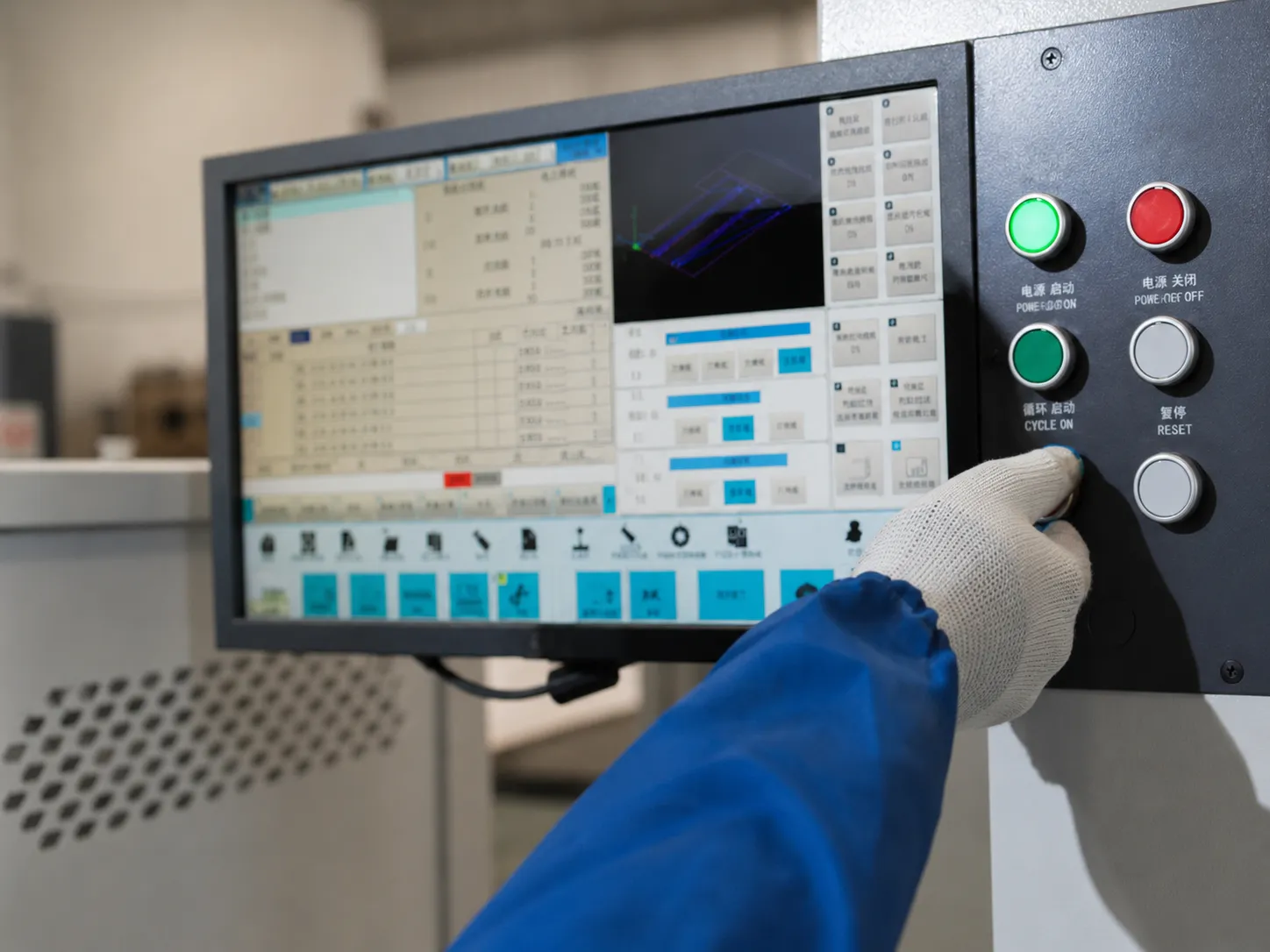 Operator using a CNC machine control panel