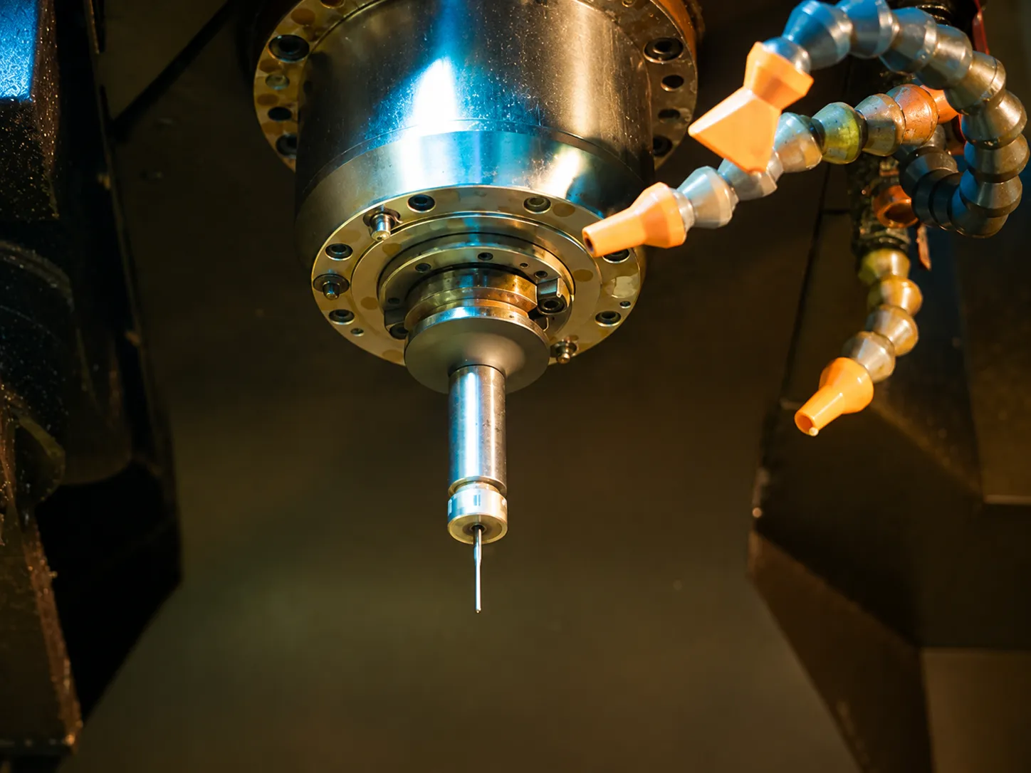 CNC Micromachining for Miniature Parts: finished micro component under inspection